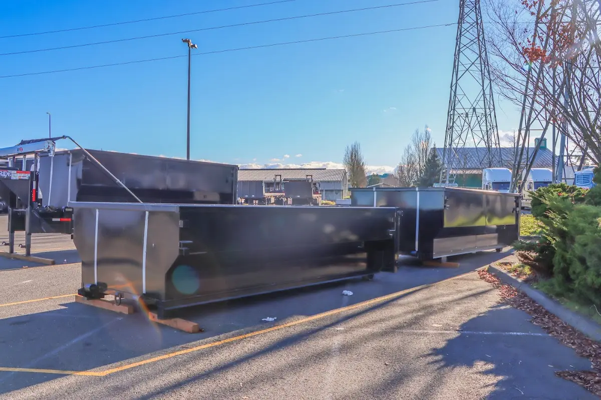 Roll-off dumpster ready for waste disposal at job site for Concrete Dumpster Rental in Lindenhurst